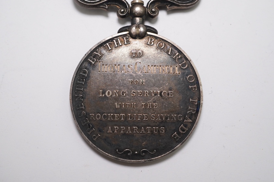 A GV Rocket Apparatus Volunteer Long Service medal to Thomas Campbell. Condition - fair.